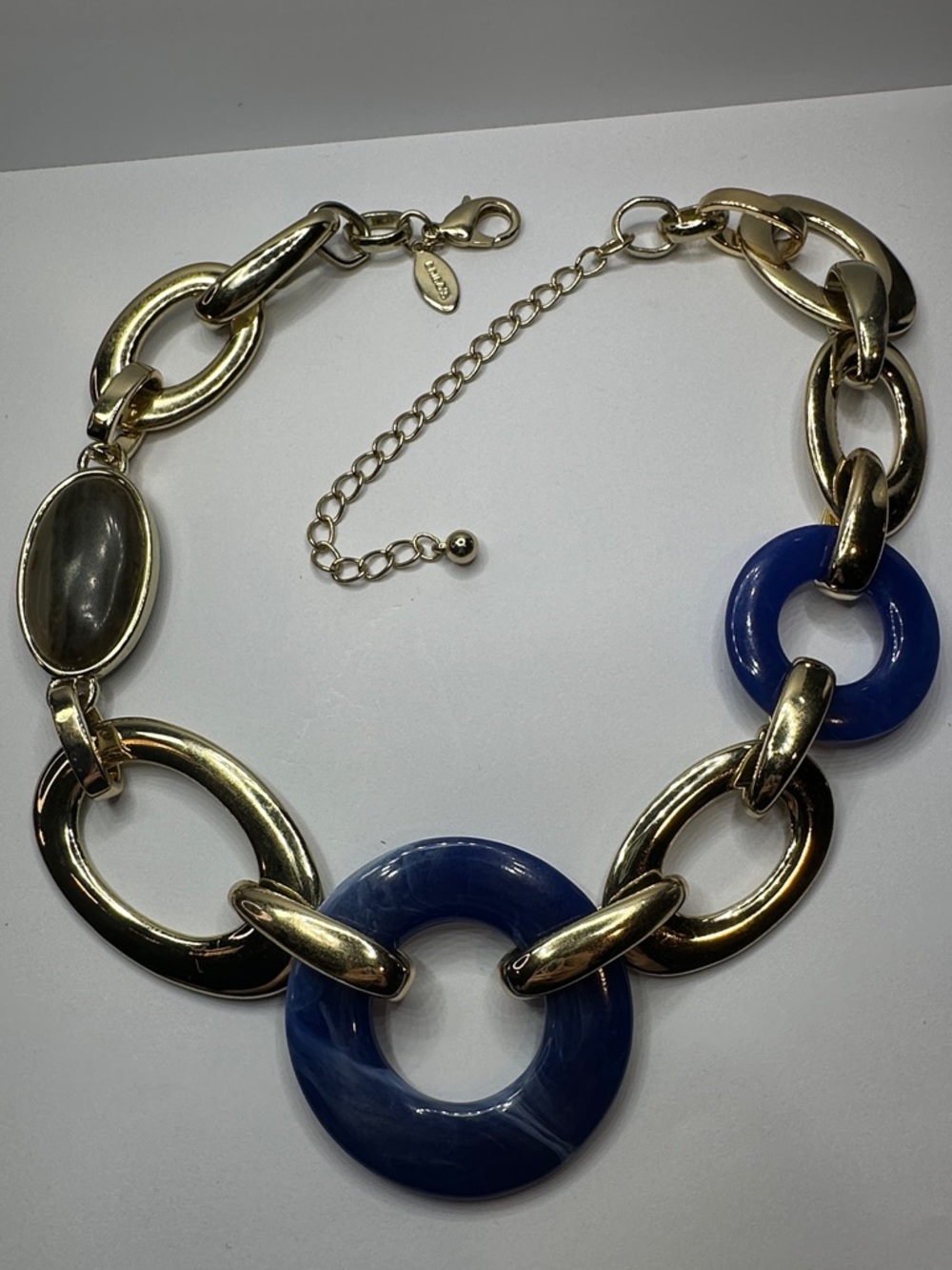 Chico's Gold-Tone Link Necklace with Deep Blue Swirled Lucite Rings - Picture 2 of 5